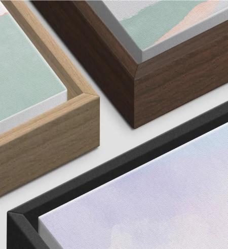 three different framed artworks, each with a distinct color and style.